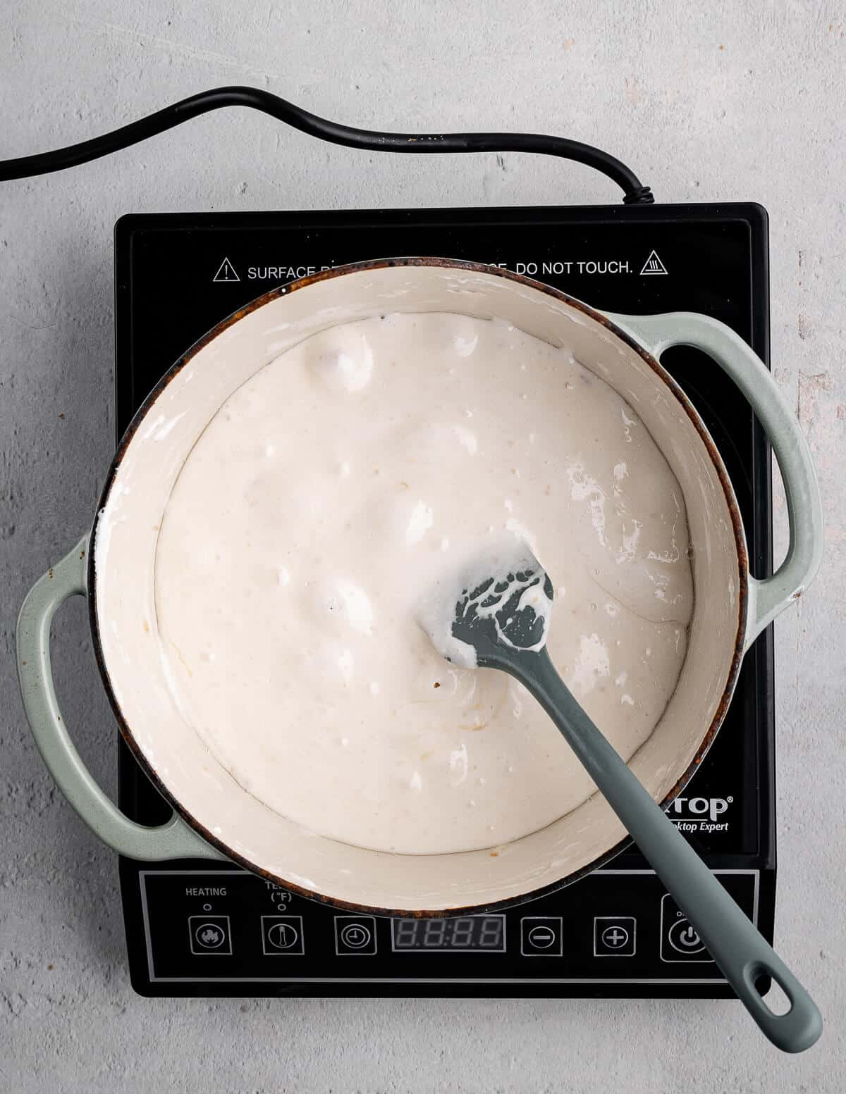 a pot with mini marshmallows and coconut oil melted together.