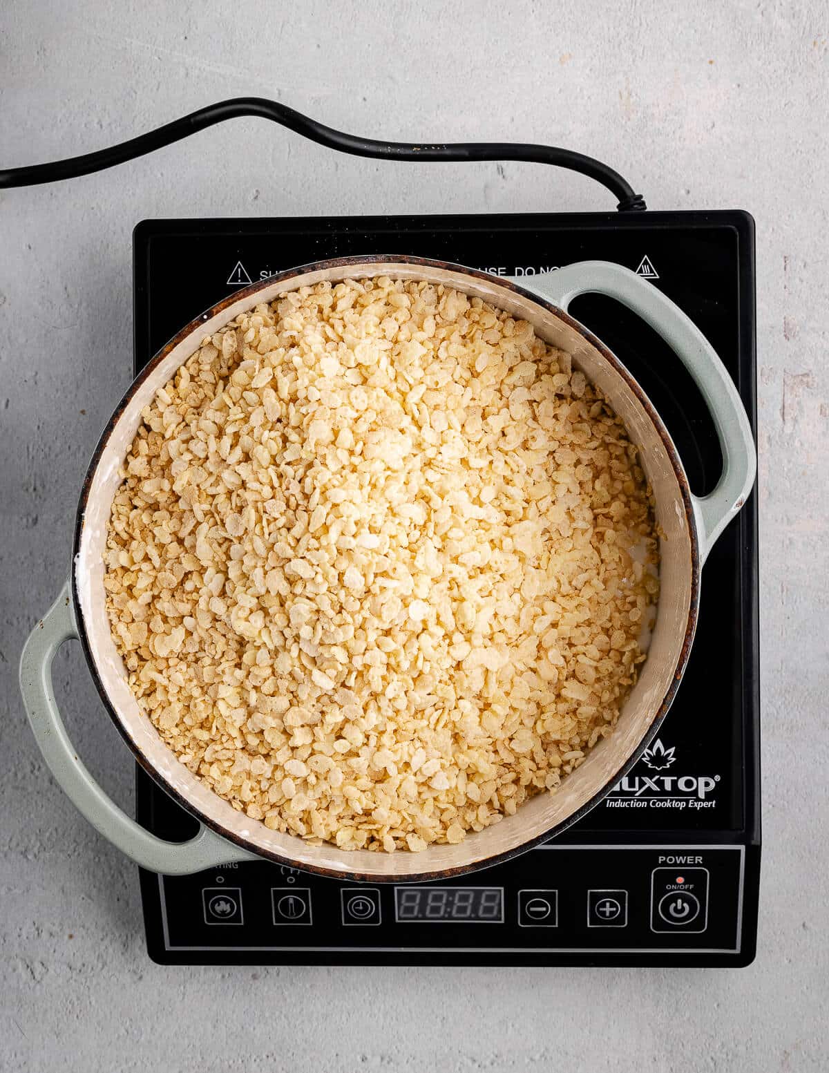 a dutch oven with rice krispies in it.