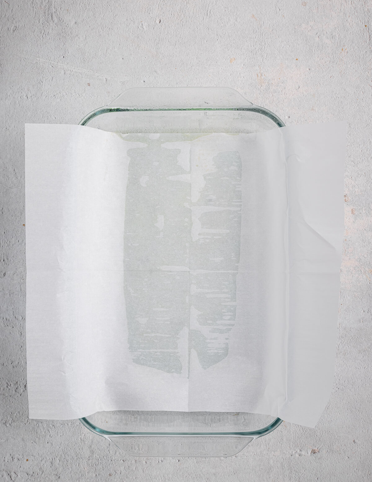 parchment paper in a glass baking dish.