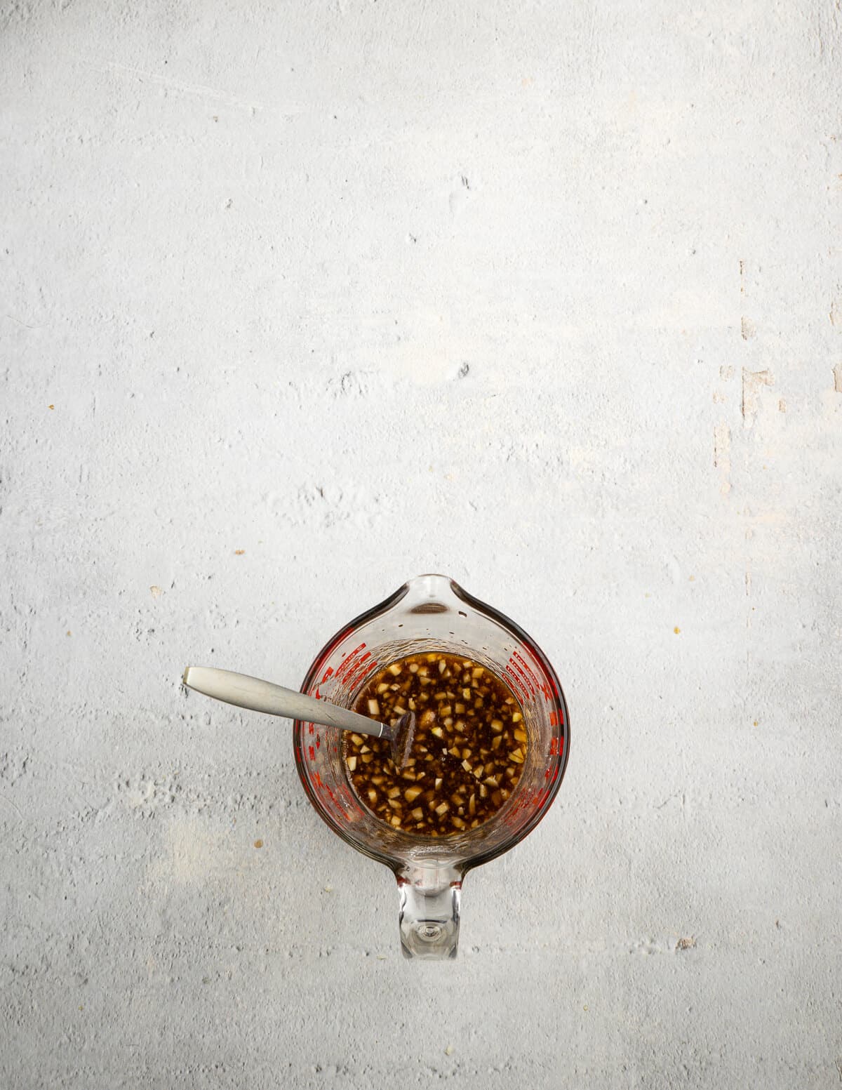 soy sauce, garlic, chicken broth, brown sugar, and sesame oil in a liquid measuring cup.