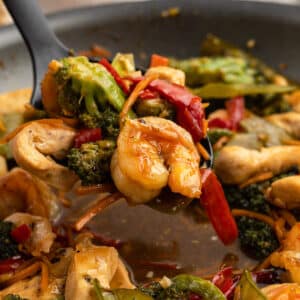 a spoonful of chicken and shrimp stir fry