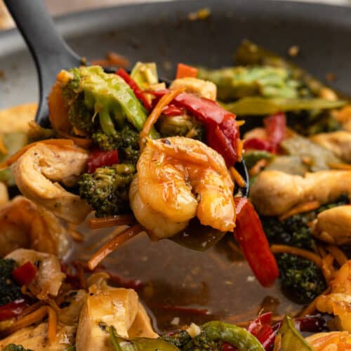 a spoonful of chicken and shrimp stir fry