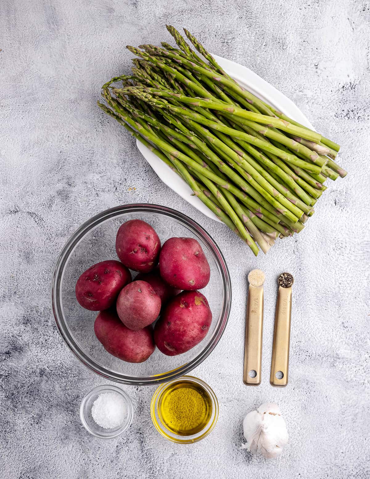 asparagus, red potatoes, garlic, olive oil, salt, pepper, and onion powder.