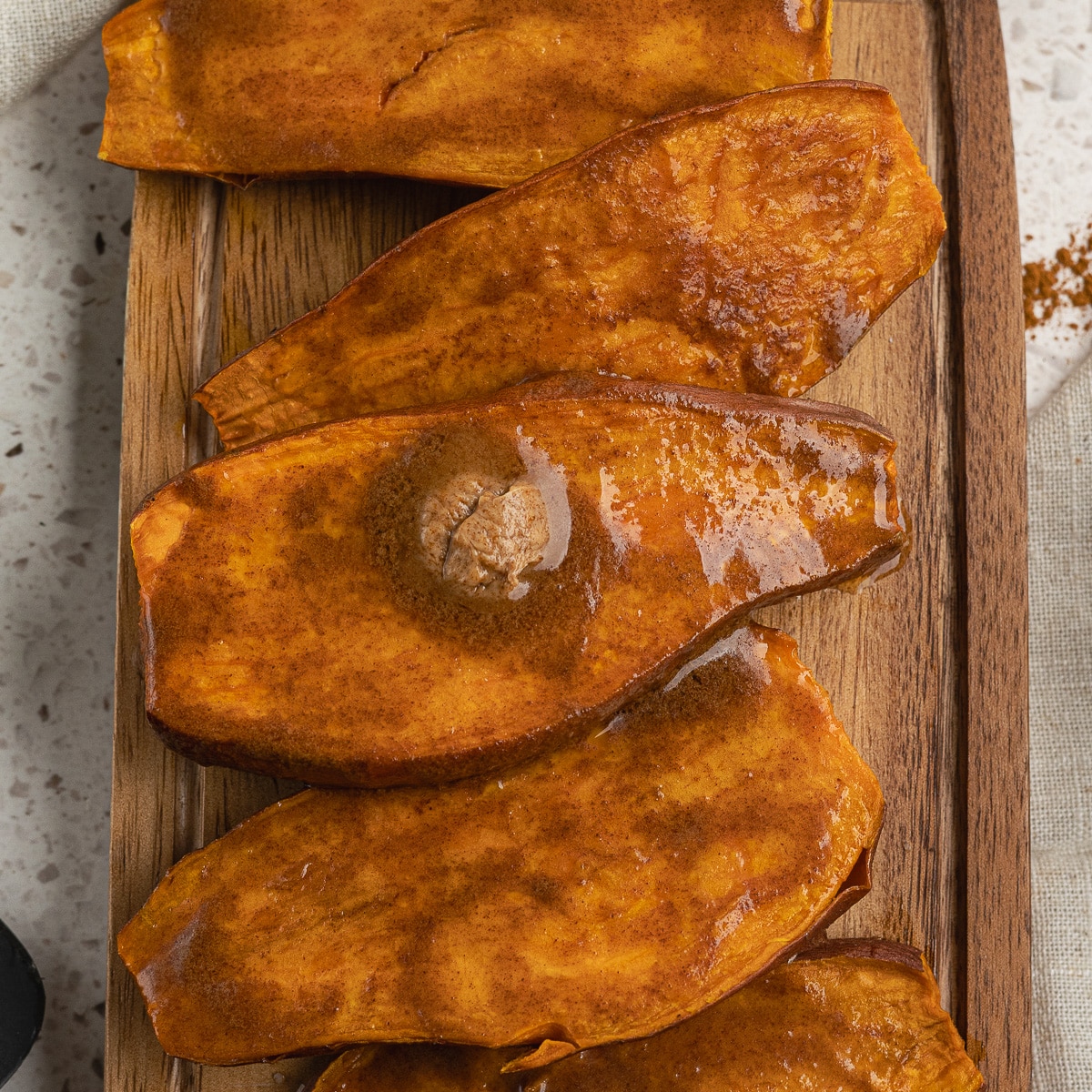 baked sweet potatoes with maple butter on top.