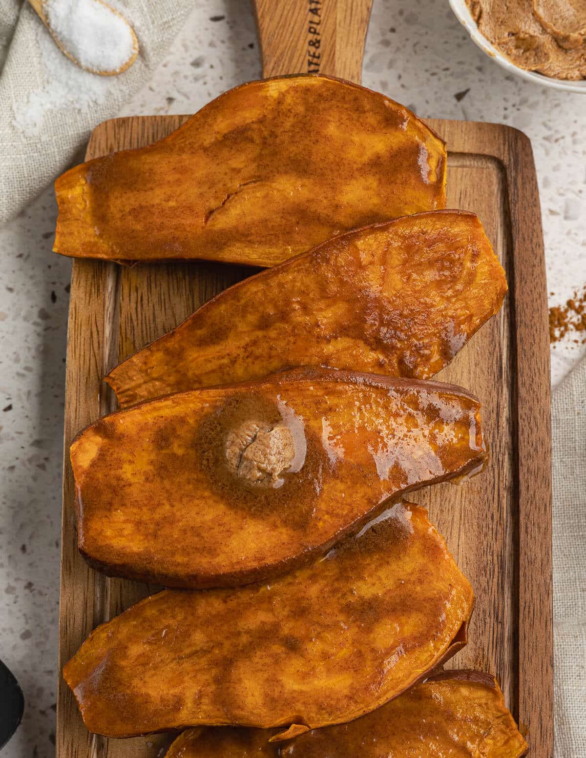baked sweet potatoes with cinnamon maple butter on top