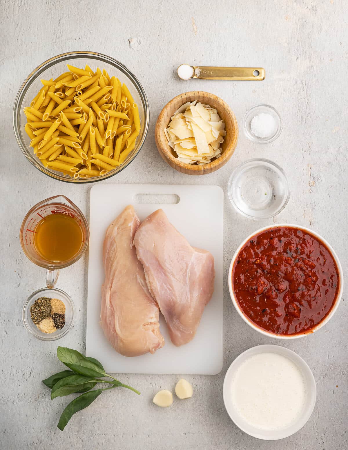pasta, parmesan, salt, chicken, spices, basil, garlic, tomatoes, heavy cream.