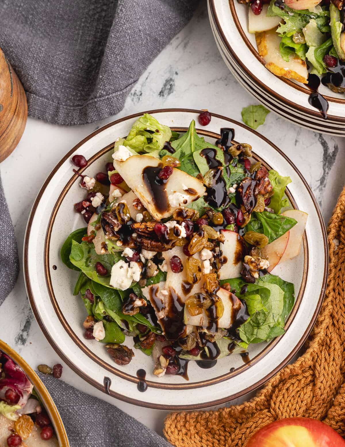 salad with pears, apples, pomegranate seeds, feta, and candied pepitas.