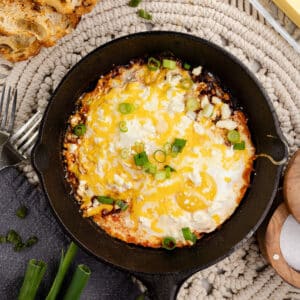 eggs with salsa in a skillet.