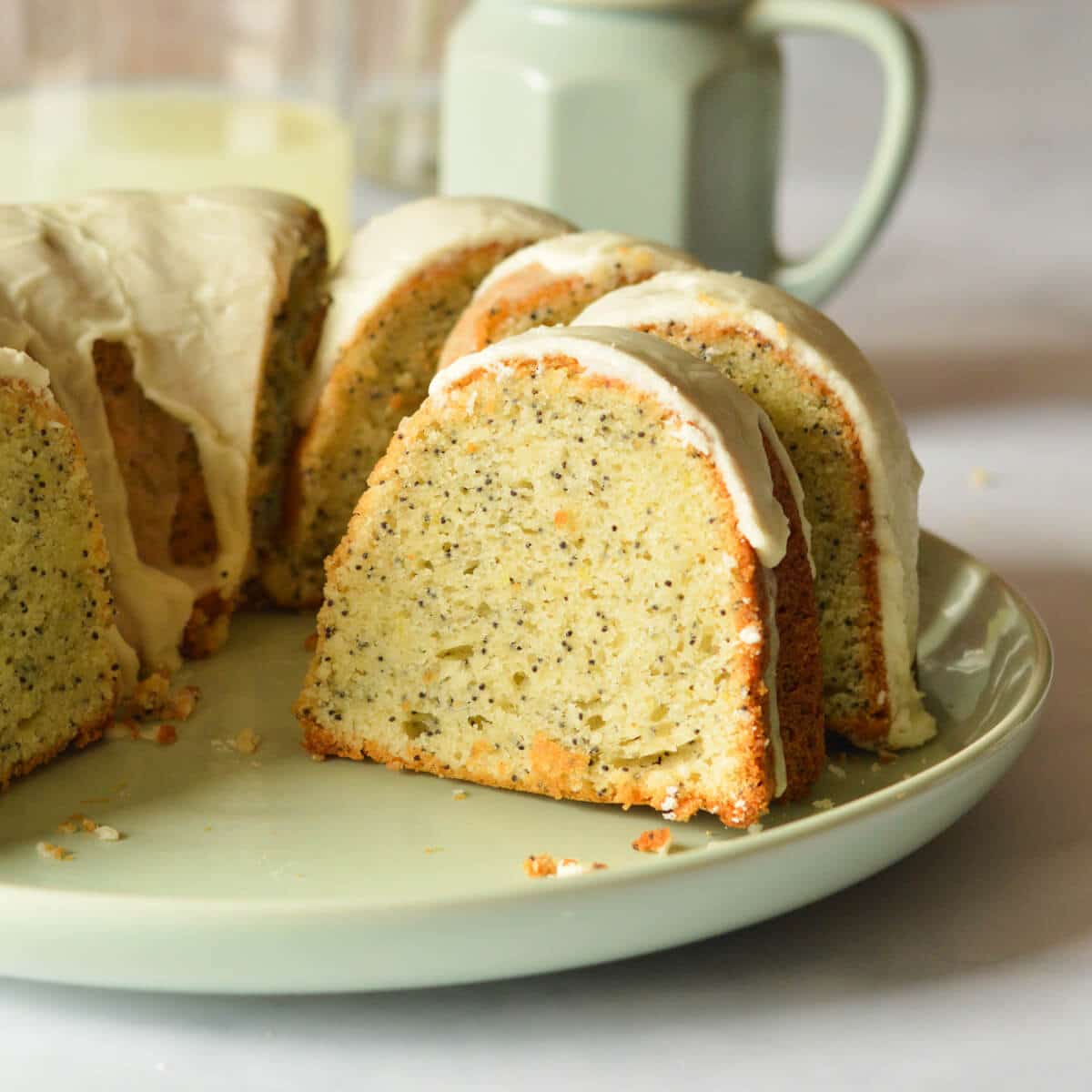 a piece of lemon poppyseed cake on a plate.