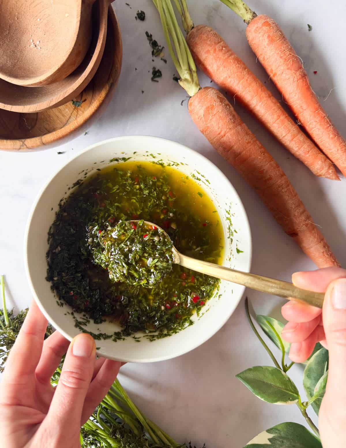 a bowl of chimichurri sauce made with carrot greens.