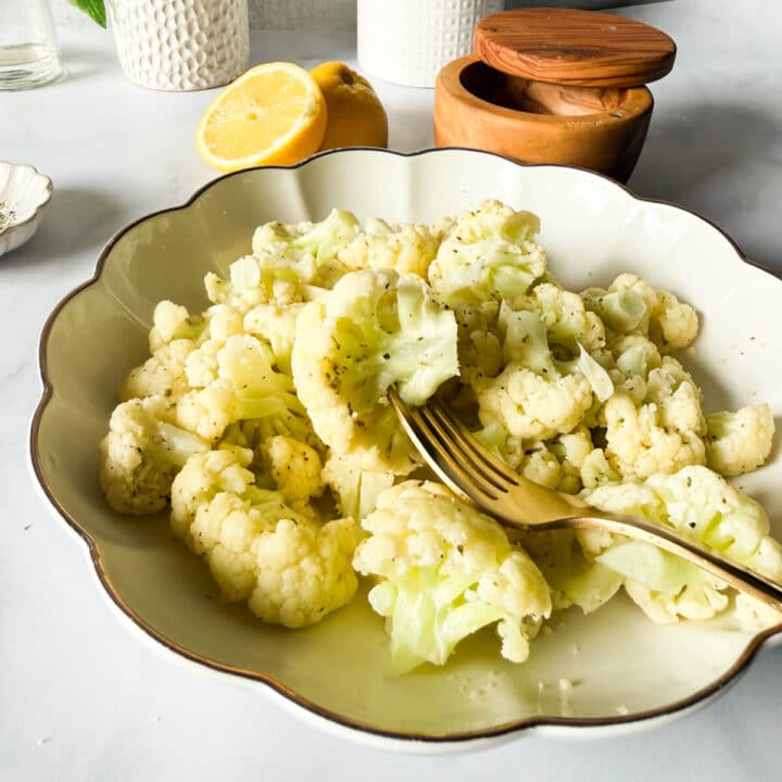 a bowl of steamed garlic butter cauliflower