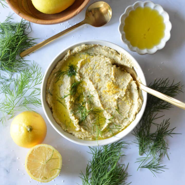 a bowl of homemade lemon dill hummus