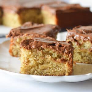 a slice of gluten free banana cake with chocolate frosting